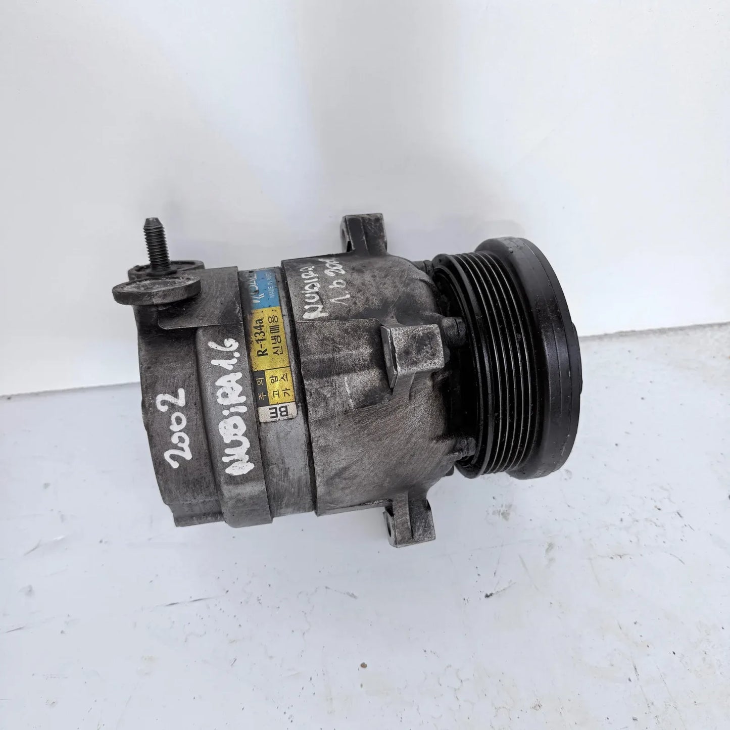 COMPRESOR A/C Daewoo Nubira 2002 - 1.6 4x2 Bencina Mecánico